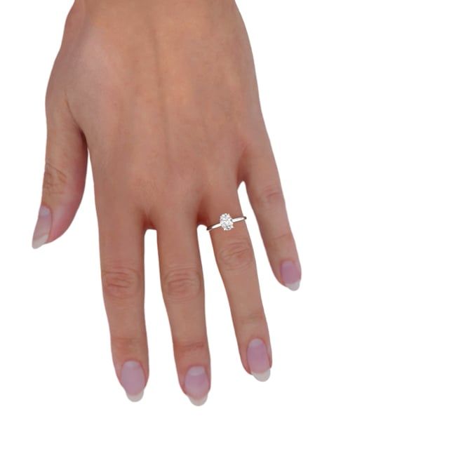 unknown – A beautiful lab grown oval cut diamond hidden halo in platinum