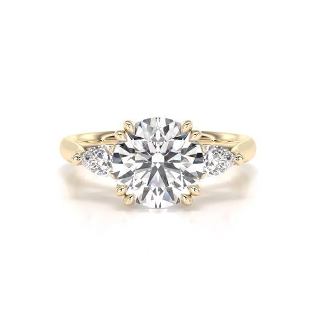 Video - A dazzling round brilliant cut lab grown diamond ring with pear shape side stones in 18ct yellow gold