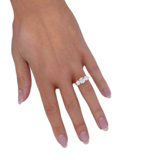 unknown – A remarkable round lab grown brilliant cut three stone trilogy diamond ring in platinum