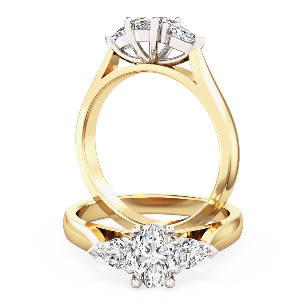 unknown – A stylish oval cut and pear shape diamond three stone in 18ct yellow & white gold