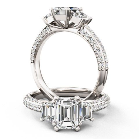 unknown – A stunning emerald cut diamond ring with shoulder stones in platinum