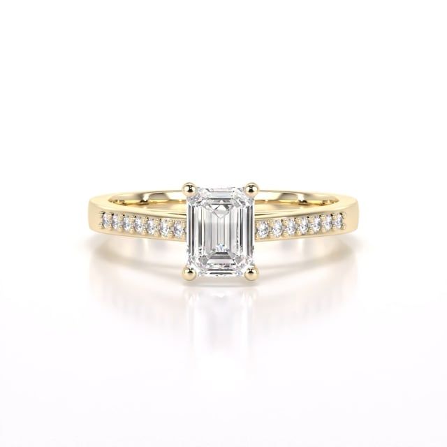 Video - A sleek lab grown emerald cut diamond ring with shoulder stones in 18ct yellow gold
